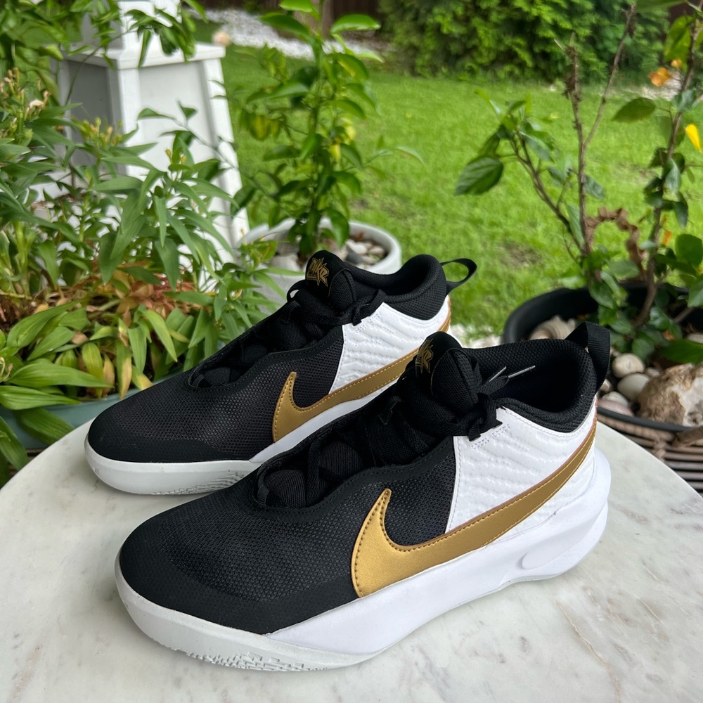 Nike Black and Gold Sneakers with Metallic Swoosh